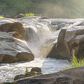 Rhythms of the Wild - A Serene River's Journey Amidst Rocky Cascades